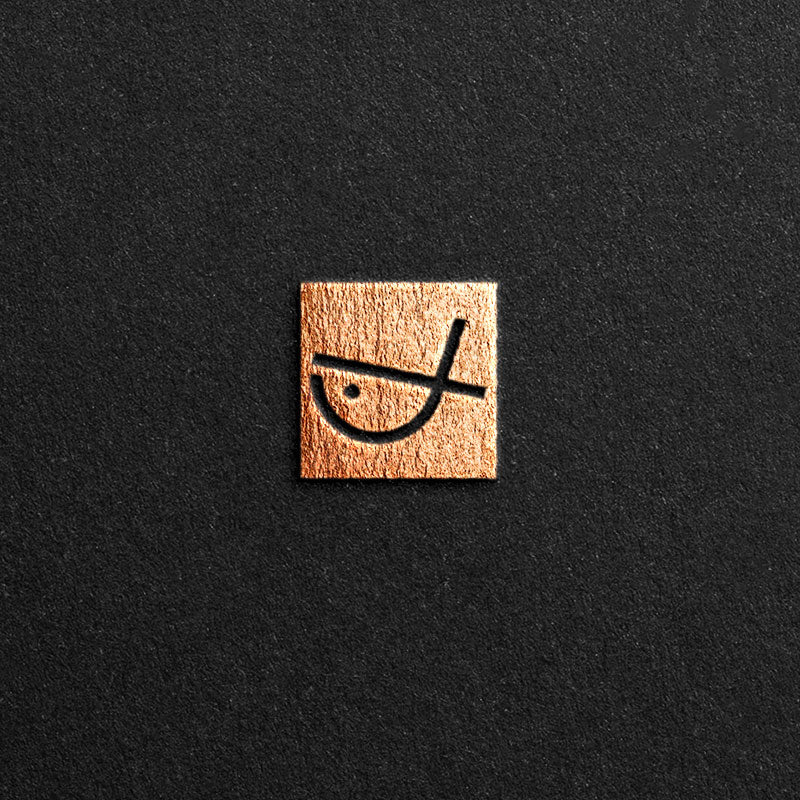 This logo is designed using the letter X, and the overall shape of the logo is a fish